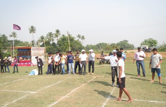 Students enthusiastically participating in sports event.